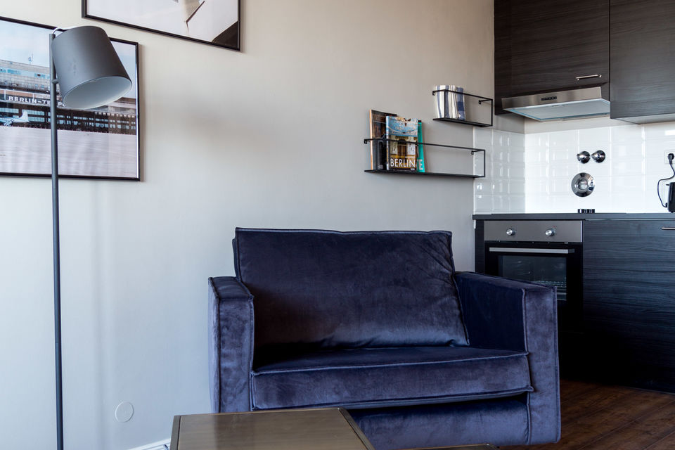Furnished apartment, living room with velvet armchair in Berlin Mitte