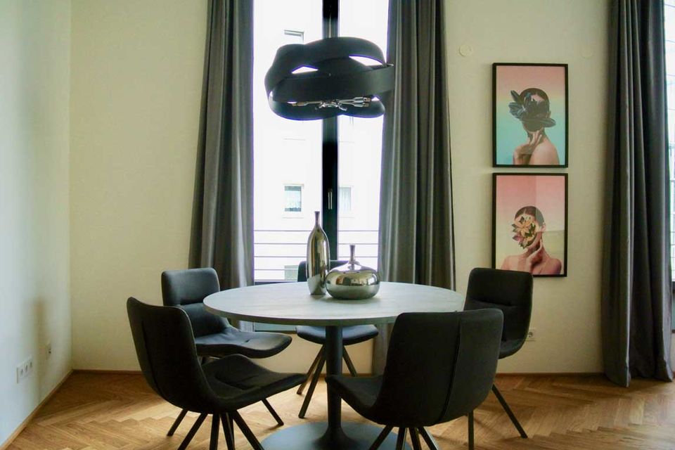 Furnished apartment, dining room with designer pendant lamp in Berlin Prenzlauer Berg