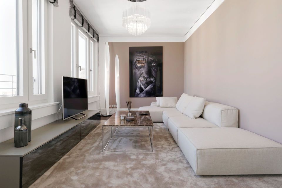 Furnished apartment, living room with modern L-shaped sofa in Berlin Mitte