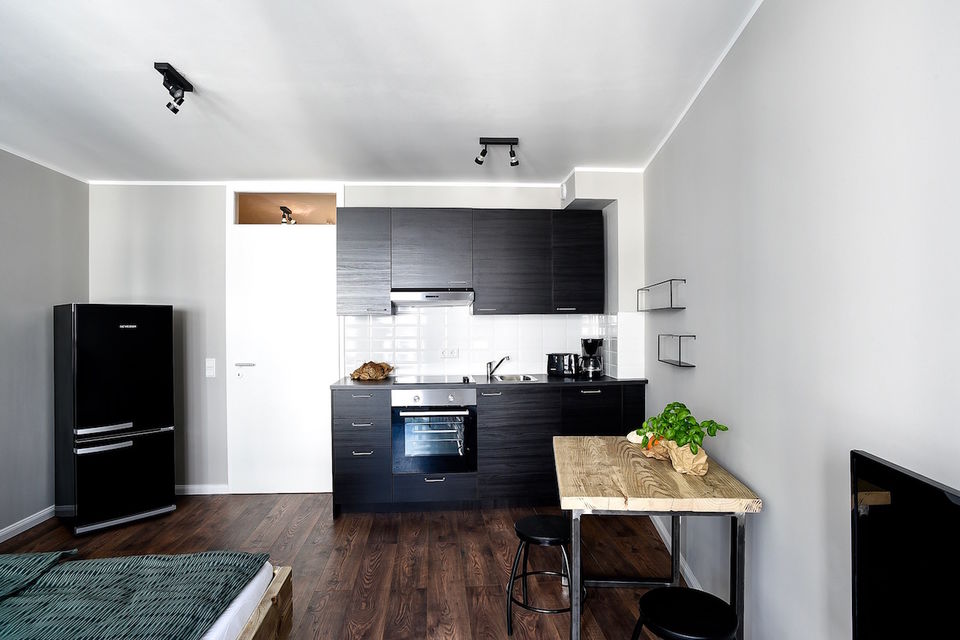 Furnished apartment, kitchen with black cabinetry in Berlin Mitte