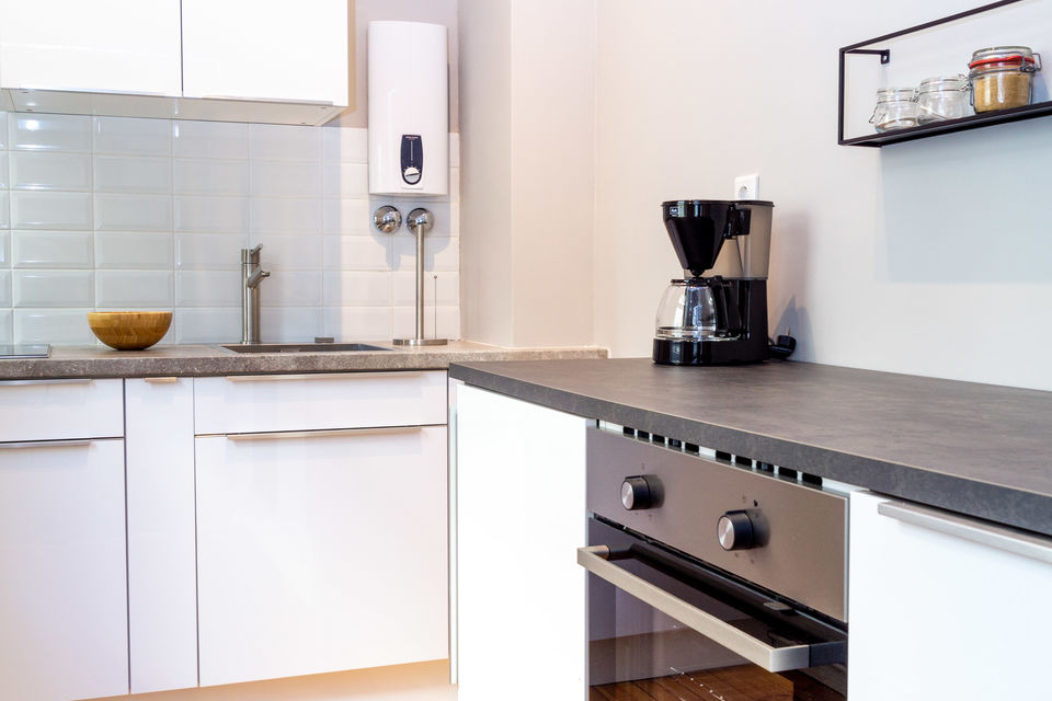 Furnished apartment, kitchen with modern cooktop in Berlin Friedrichshain