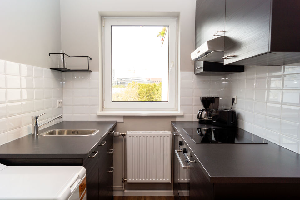 Furnished apartment, kitchen with white wall tiles in Berlin Schöneberg