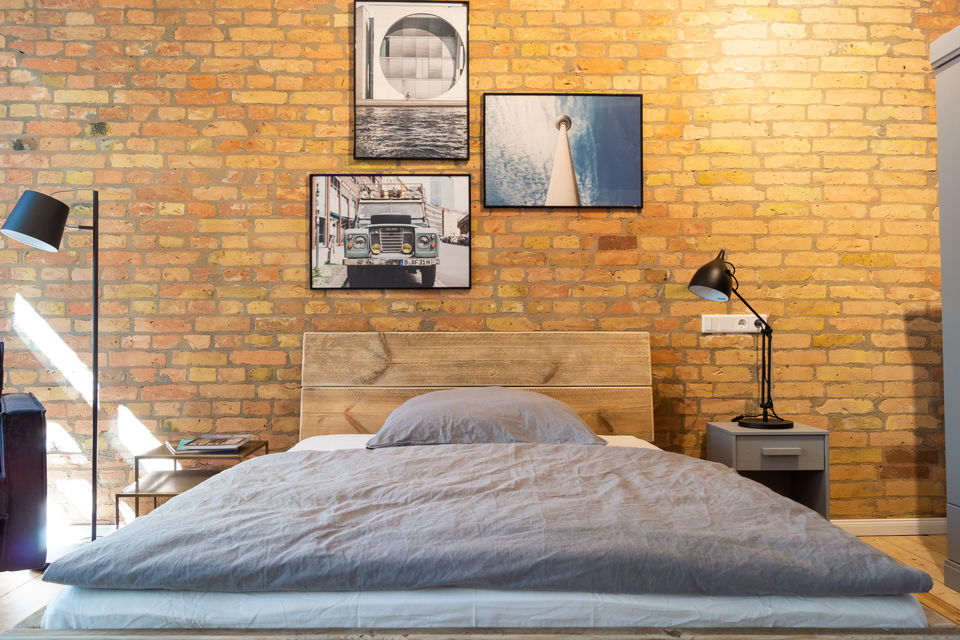 Furnished apartment, bedroom with exposed brick wall in Berlin Friedrichshain