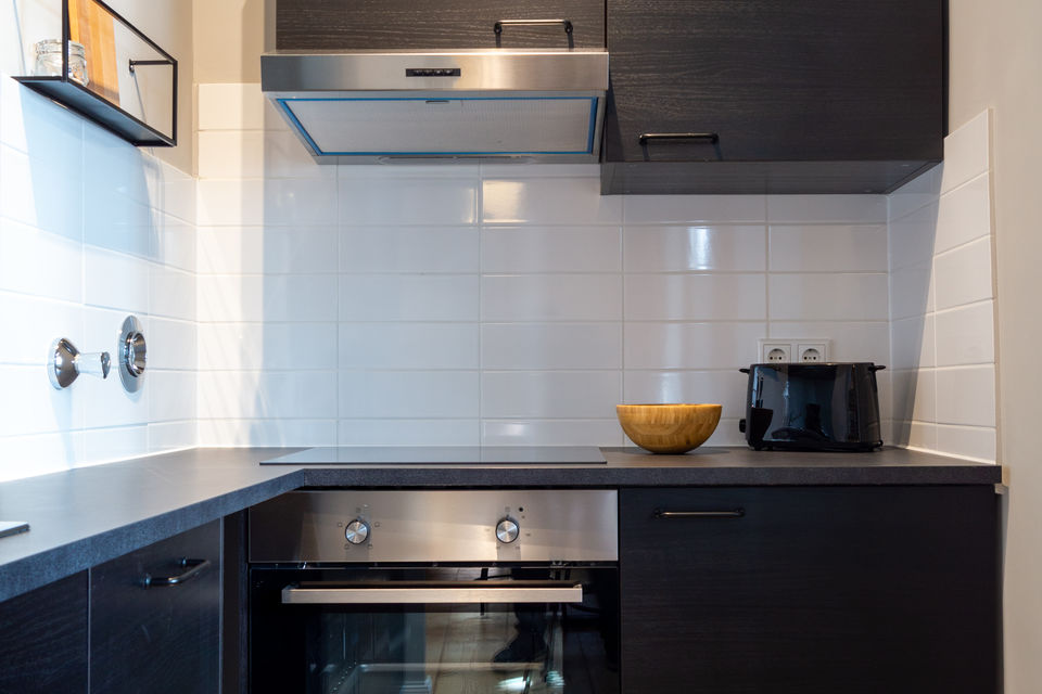 Furnished apartment, kitchen with white wall tiles in Berlin Friedrichshain