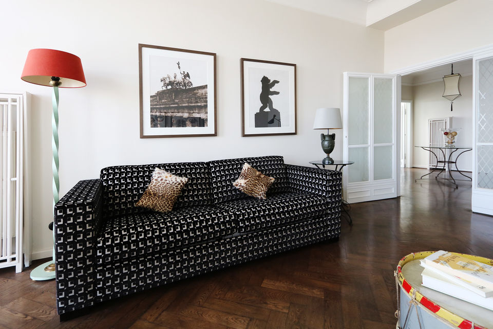 Furnished apartment, living room with black designer sofa in Berlin Friedrichshain