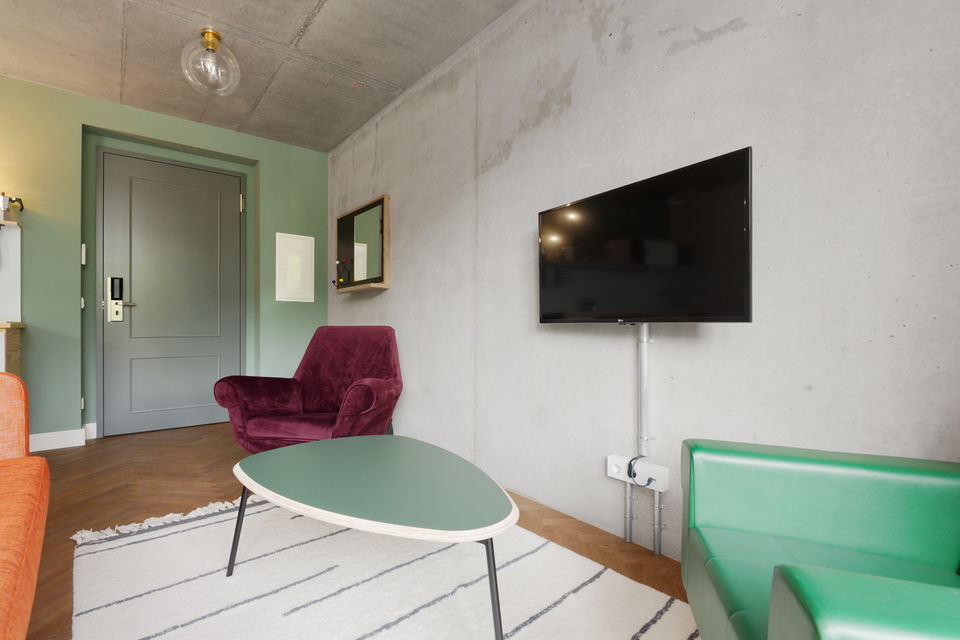 Serviced apartment, living room with mint green accent in Berlin Mitte