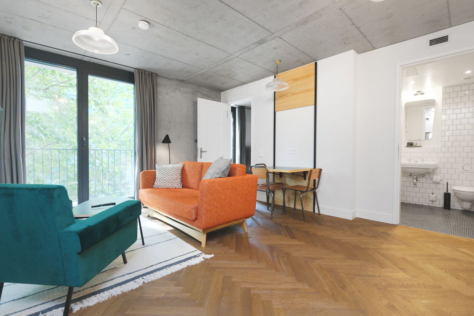 Serviced apartment, living room with balcony access in Berlin Mitte