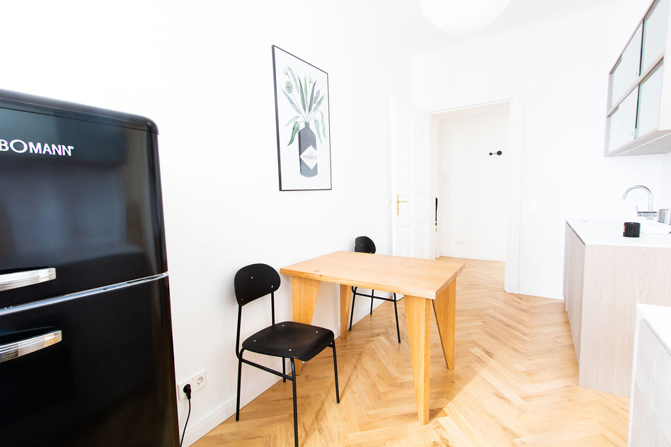 Furnished apartment, dining room with wooden table in Berlin Mitte