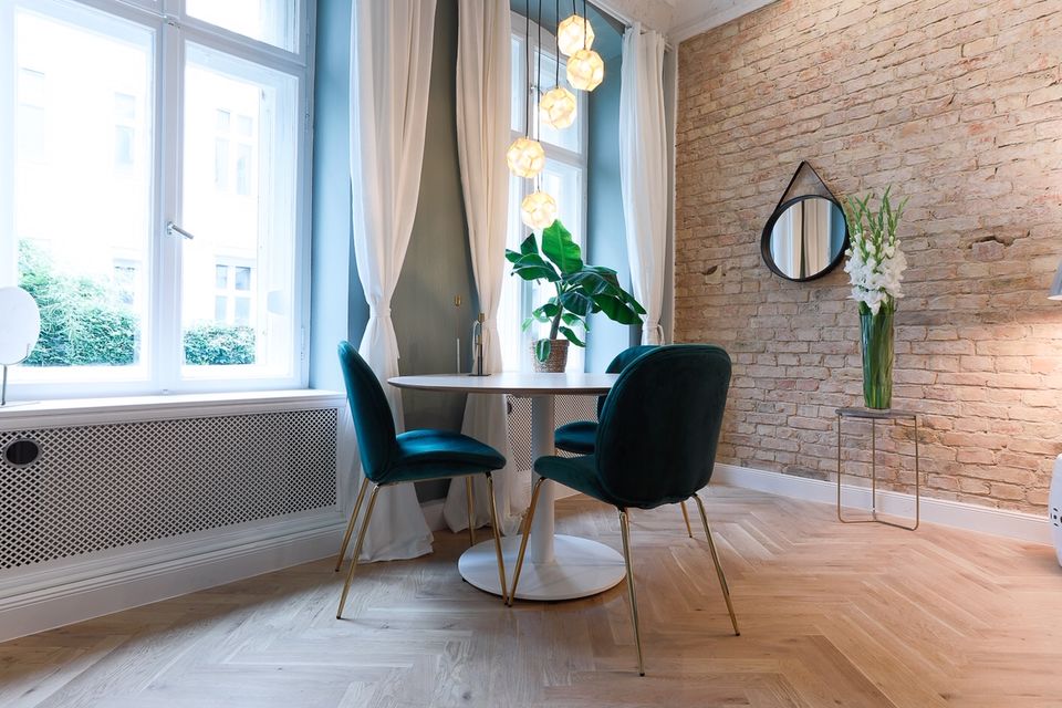 Furnished apartment, living room with exposed brick wall in Berlin Prenzlauer Berg