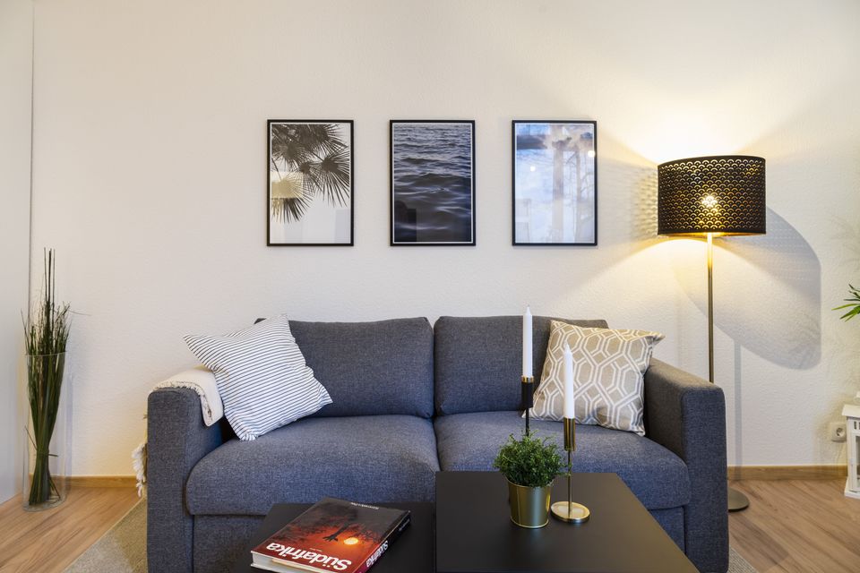 Furnished apartment, living room with designer floor lamp in Berlin Prenzlauer Berg