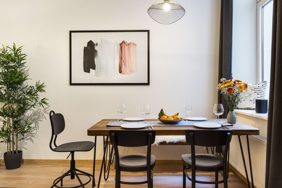 Furnished apartment, dining room with wooden table in Berlin Prenzlauer Berg