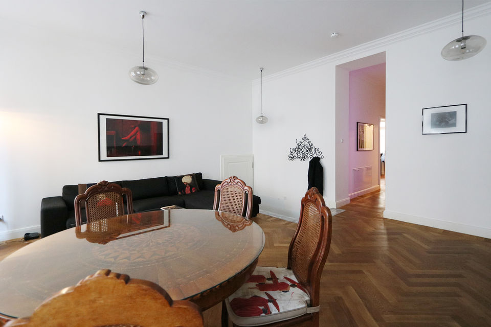 Furnished apartment, living room with dining table and designer furniture in Berlin Mitte