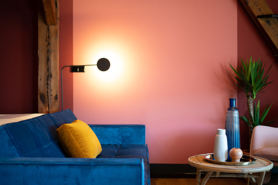 Furnished apartment, living room with colorful wall design in Berlin Mitte