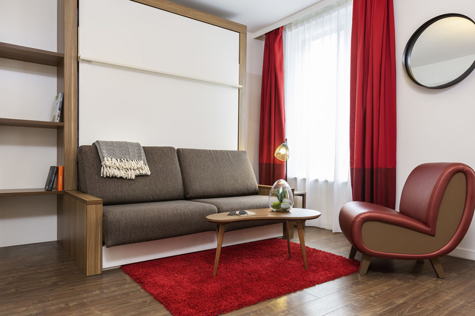 Serviced apartment, living room with wall bed in Munich Ludwigsvorstadt