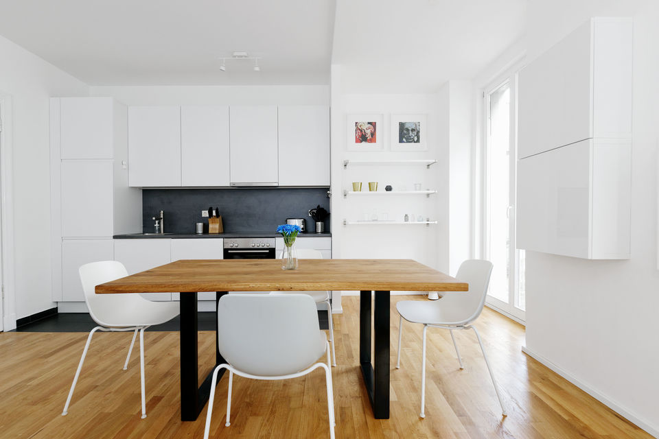 Furnished apartment, dining room with wooden table in Berlin Mitte