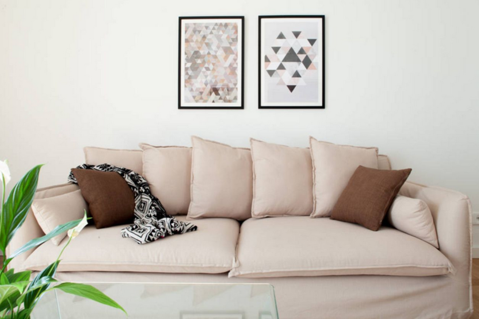 Furnished apartment, living room with beige sofa in Berlin Mitte