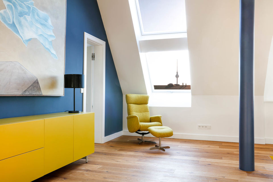 Furnished apartment, living room with yellow designer furniture in Berlin Prenzlauer Berg
