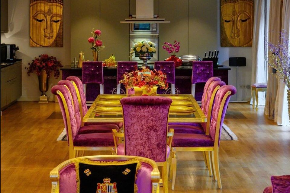 Luxury apartment, dining room with purple velvet furniture in Berlin Mitte