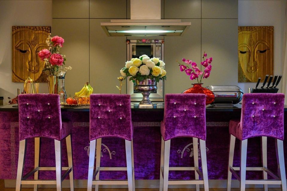 Luxury apartment, kitchen with purple velvet bar stools in Berlin Mitte