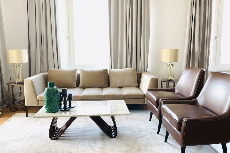 Furnished apartment, living room with elegant leather armchairs in Berlin Mitte