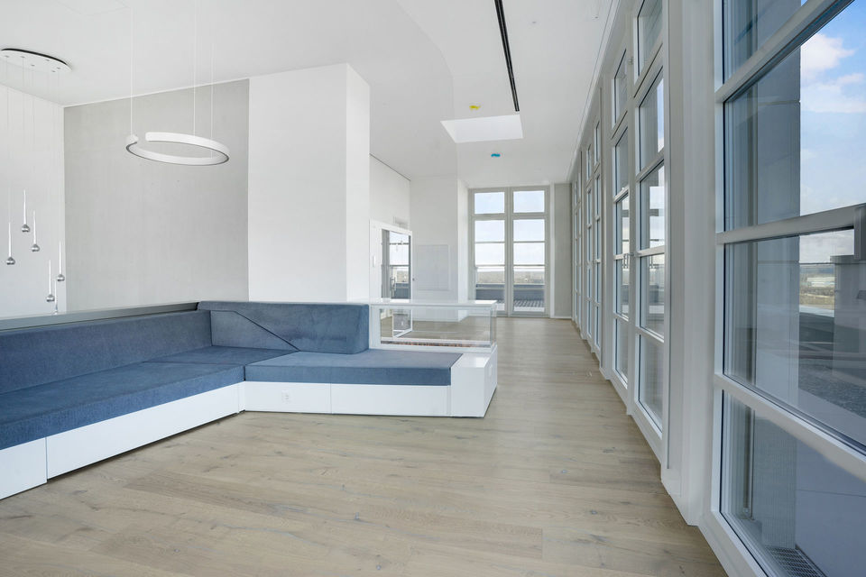 Furnished apartment, living room with blue corner sofa in Berlin Charlottenburg