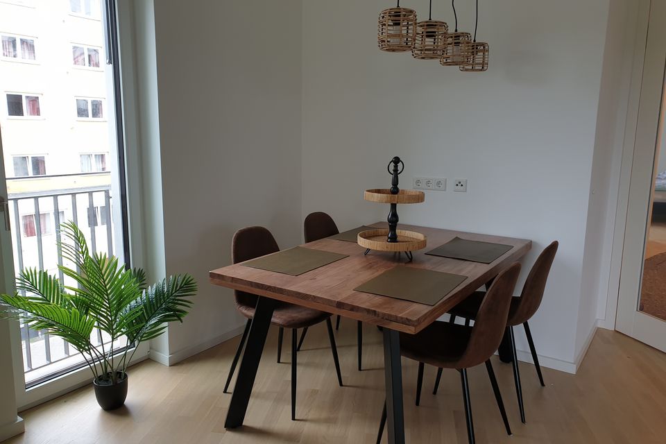 Furnished apartment, dining room with wooden table in Berlin Schöneberg