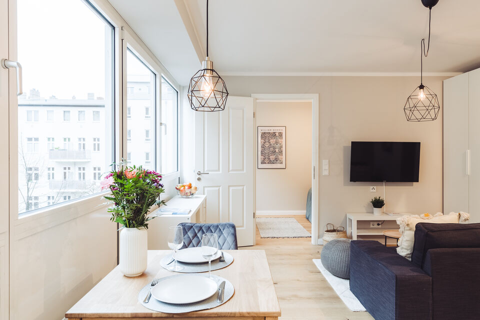 Furnished apartment, living room with dining area and city view in Berlin Prenzlauer Berg
