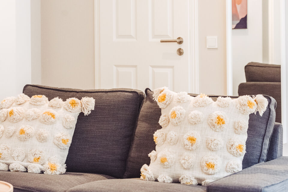 Furnished apartment, living room with patterned sofa in Berlin Prenzlauer Berg