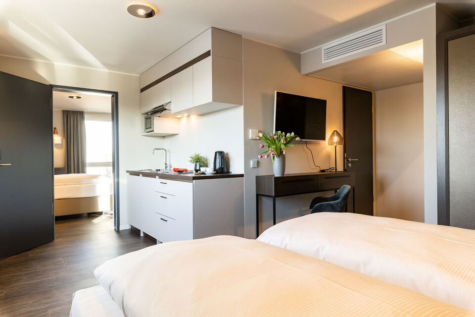 Serviced apartment, bedroom with integrated kitchenette in München Aschheim-Dornach