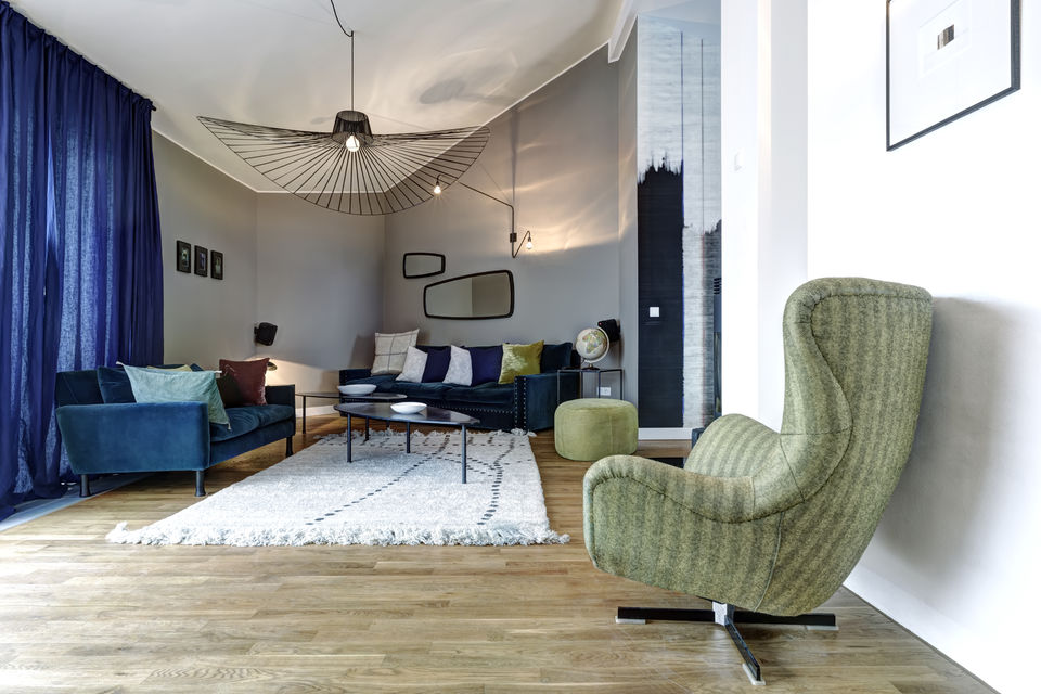 Serviced apartment, living room with designer ceiling lamp in Berlin Mitte