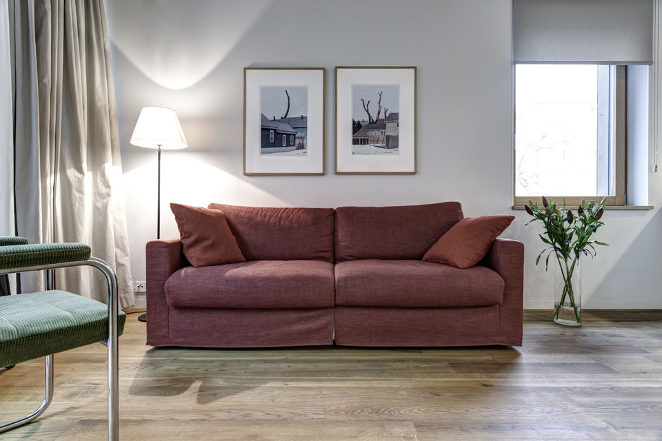 Furnished apartment, living room with burgundy sofa in Berlin Friedrichshain