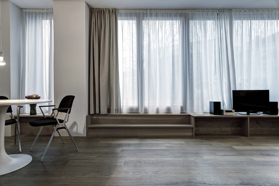 Furnished apartment, living room with floor-to-ceiling windows in Berlin Friedrichshain