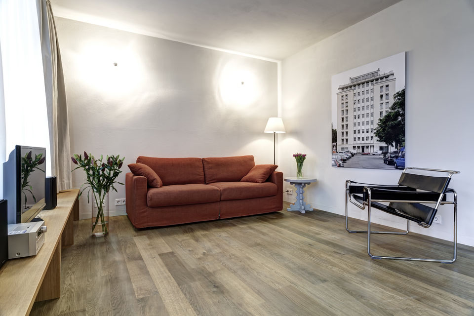 Furnished apartment, living room with terracotta sofa in Berlin Friedrichshain