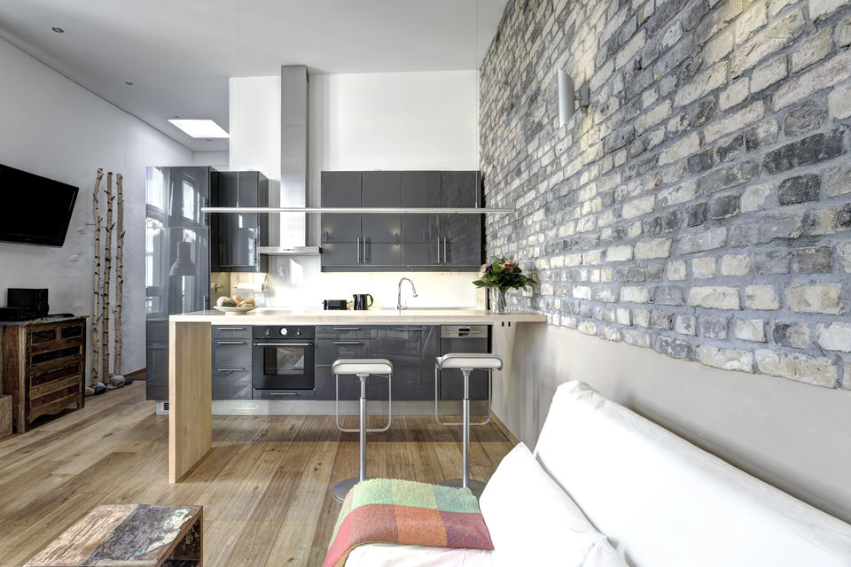 Furnished apartment, kitchen with exposed brick wall in Berlin Friedrichshain