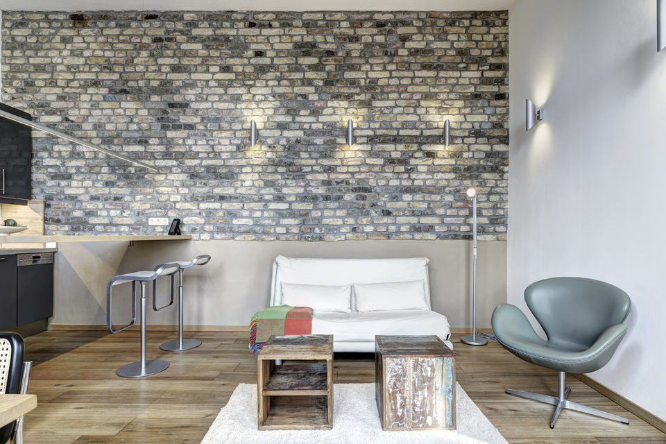 Furnished apartment, living room with exposed brick wall in Berlin Friedrichshain