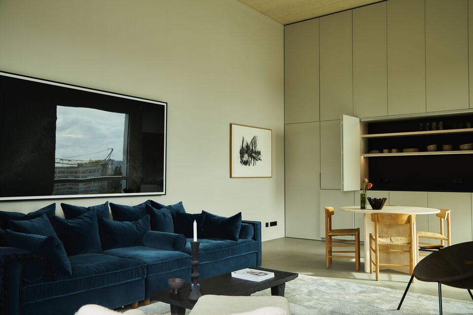 Furnished apartment, living room with blue velvet sofa in Berlin Wedding