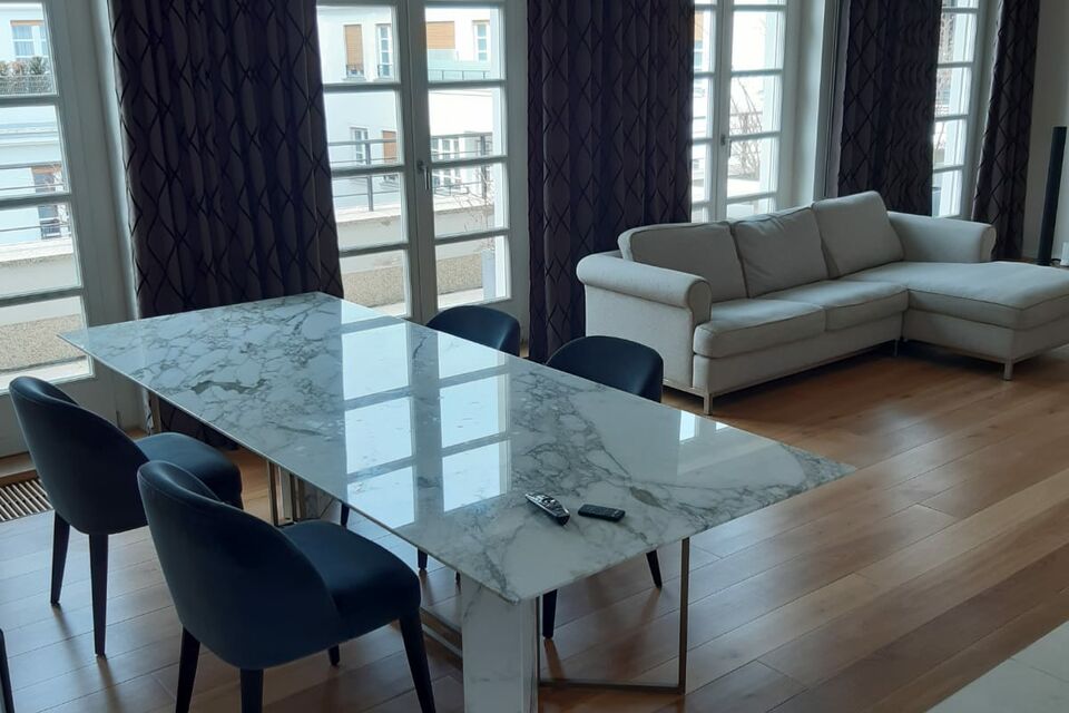 Furnished apartment, living room with marble table in Munich Maxvorstadt