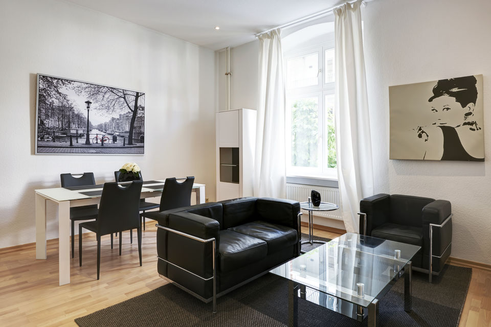 Furnished apartment, living room with black designer furniture in Berlin Mitte