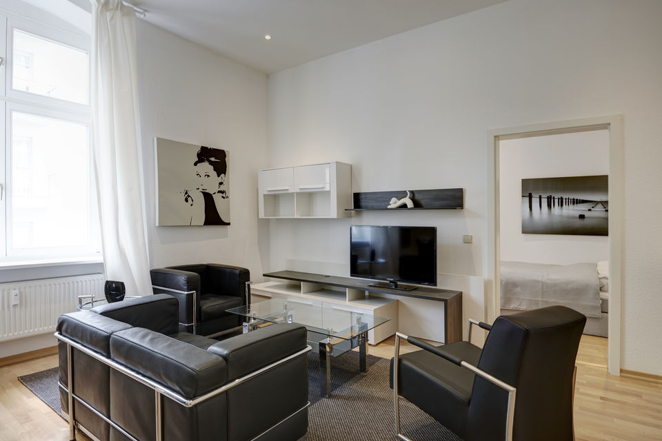 Furnished apartment, living room with modern media wall in Berlin Mitte
