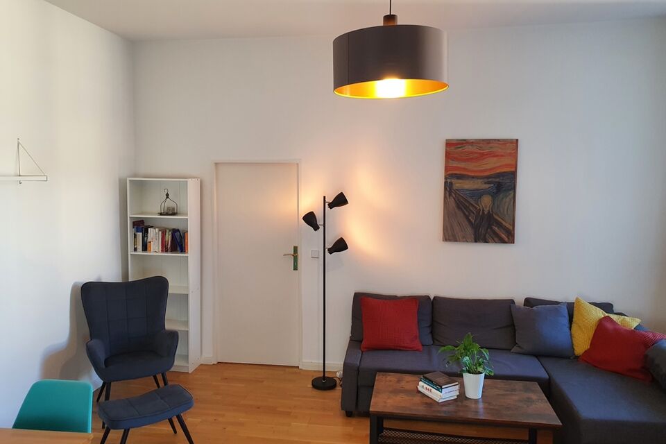 Furnished apartment, living room with colorful accent pillows in Berlin Schöneberg