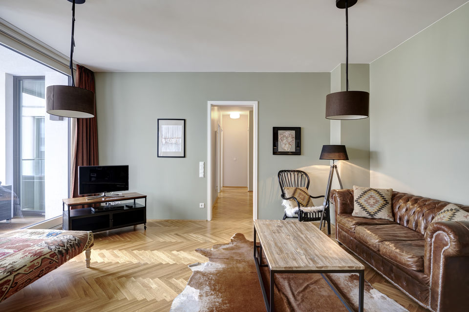 Serviced apartment, living room with Chesterfield sofa in Berlin Mitte