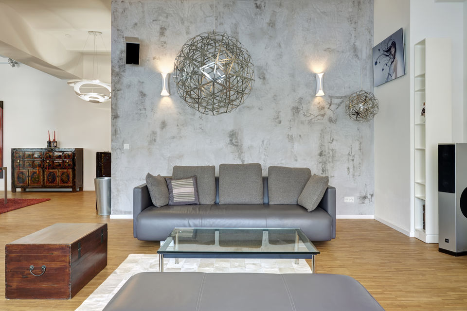 Furnished apartment, living room with concrete wall in Berlin Mitte