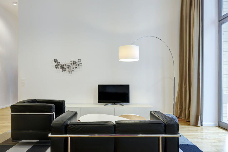Furnished apartment, living room with arc floor lamp in Berlin Mitte