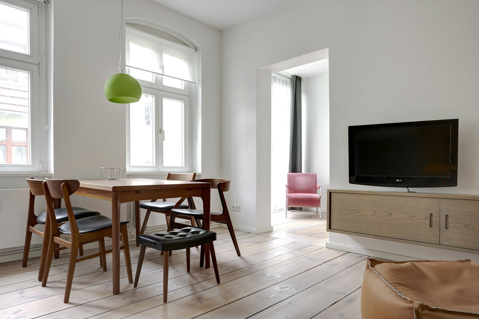 Furnished apartment, living room with wooden furniture in Berlin Mitte