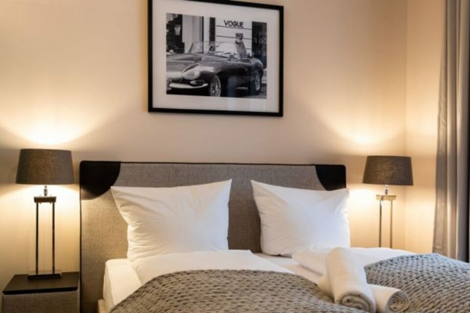 Furnished apartment, bedroom with elegant lighting in Frankfurt Innenstadt