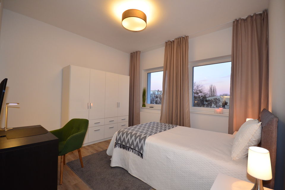 Serviced Apartment, Schlafzimmer mit Stadtblick in Berlin Mitte