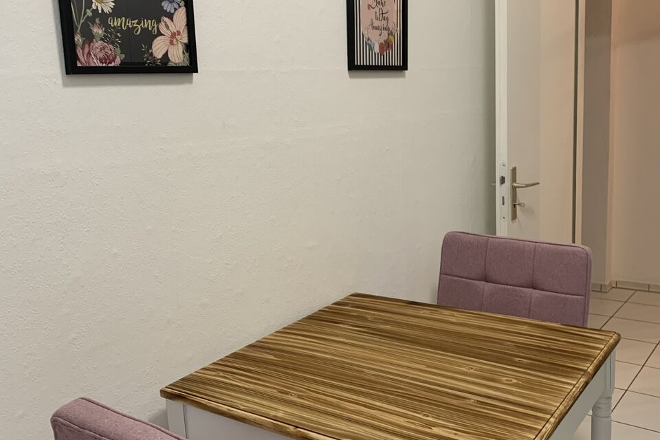 Furnished apartment, dining room with wooden table in Berlin Prenzlauer Berg