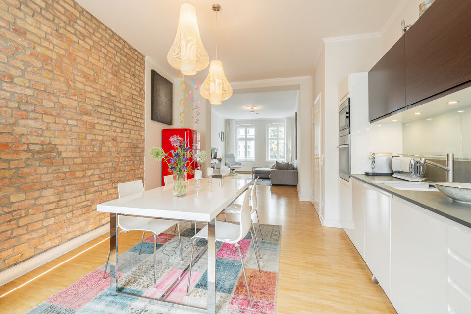Furnished apartment, dining room with exposed brick wall in Berlin Mitte