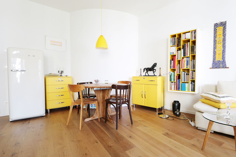 Furnished apartment, dining room with yellow vintage furniture in Berlin Mitte
