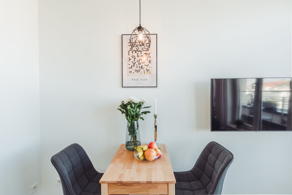 Furnished apartment, dining room with wooden table in Berlin Prenzlauer Berg